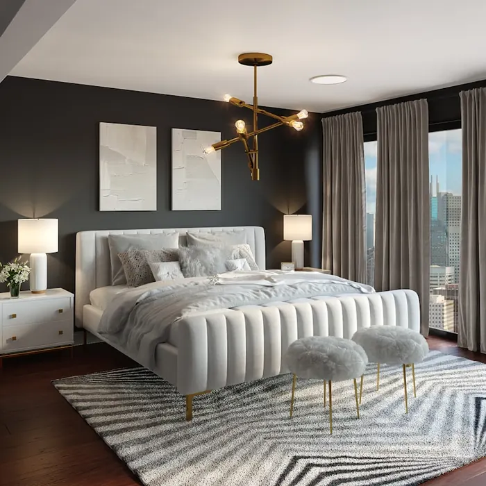 Immaculate bedroom with dressed bed and brass pendant lighting