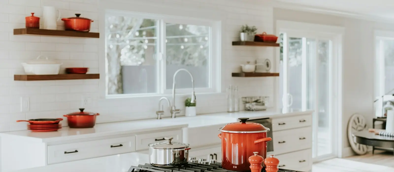 Bright kitchen with open shelving and spotless worktops